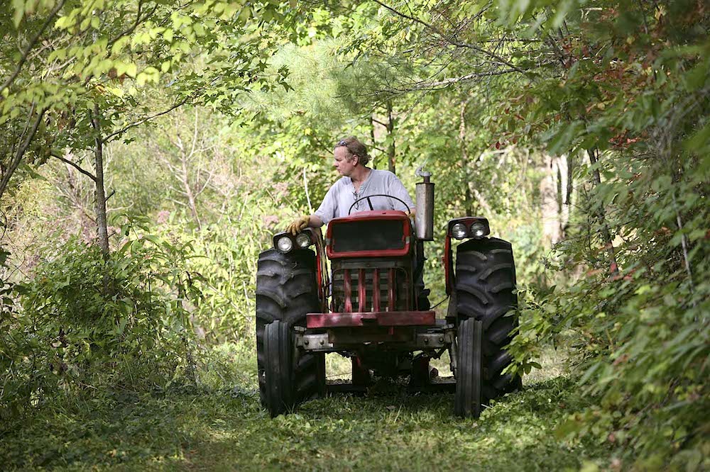 On his beloved property in Probst, site of a cabin named the Hodge Podge Lodge. (Photo by Joe Stewardson)