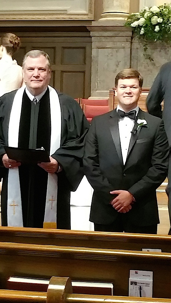 Dr. Tom Ogburn, pastor of First Baptist Church of Knoxville, and the groom await the bridal party.