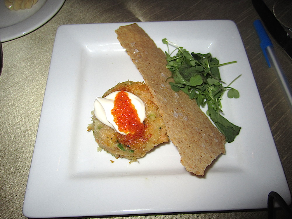 The very interesting first course was a lightly smoked Sunburst trout cake with creme fraiche, trout roe, cornmeal crackers and young arugula. All locally sourced.