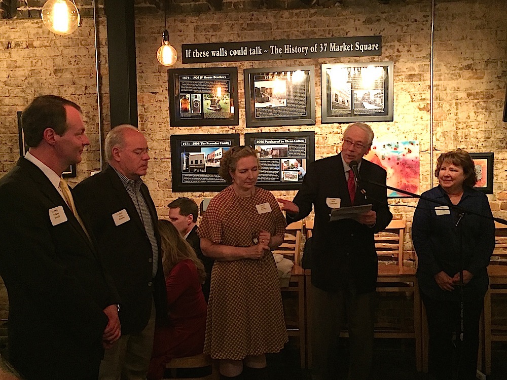 My husband, Alan Carmichael, introducing Nathan Rowell at the party we co-hosted Tuesday night. From left, Rowell, Gary and Julia Bentley, our co-hosts, and me, at right.