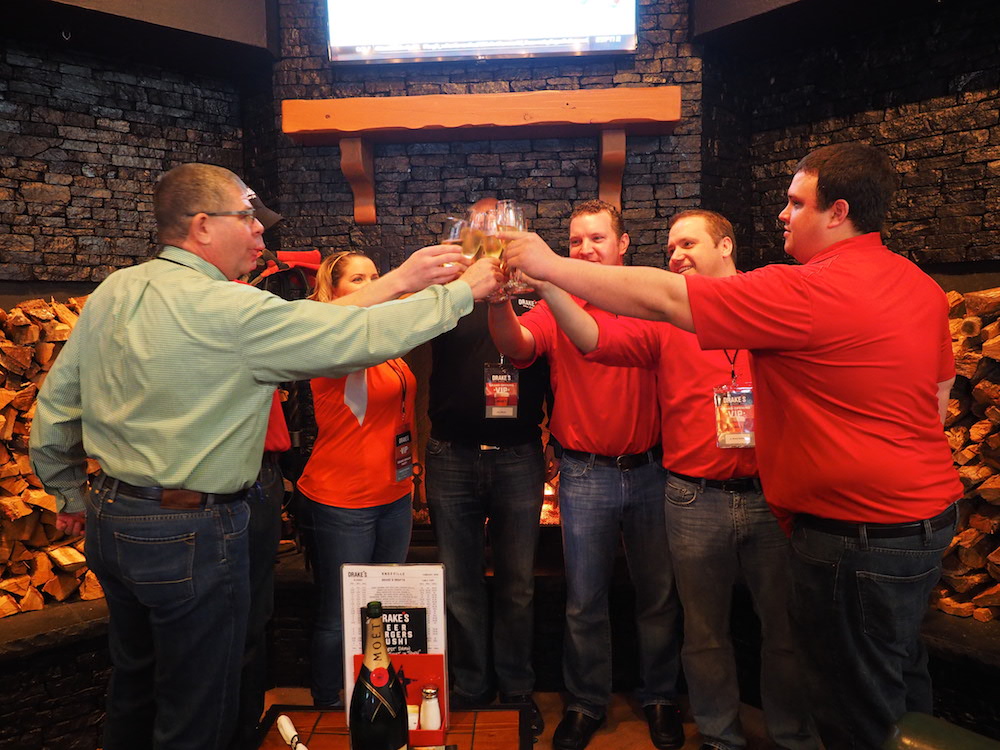 Management team toasts the opening evening. (Photo by Gary Heatherly.)