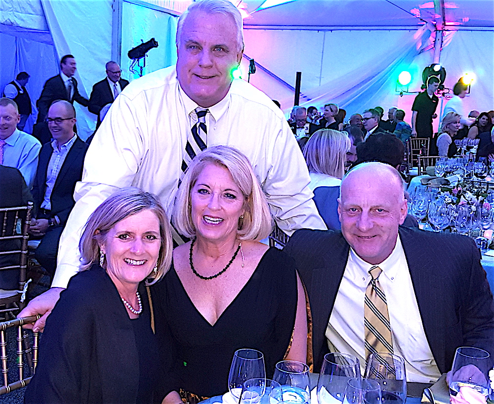 Tom Coulter, standing, behind, from left, Tami Hartmann, Mindy Coulter and Bruce Hartmann.
