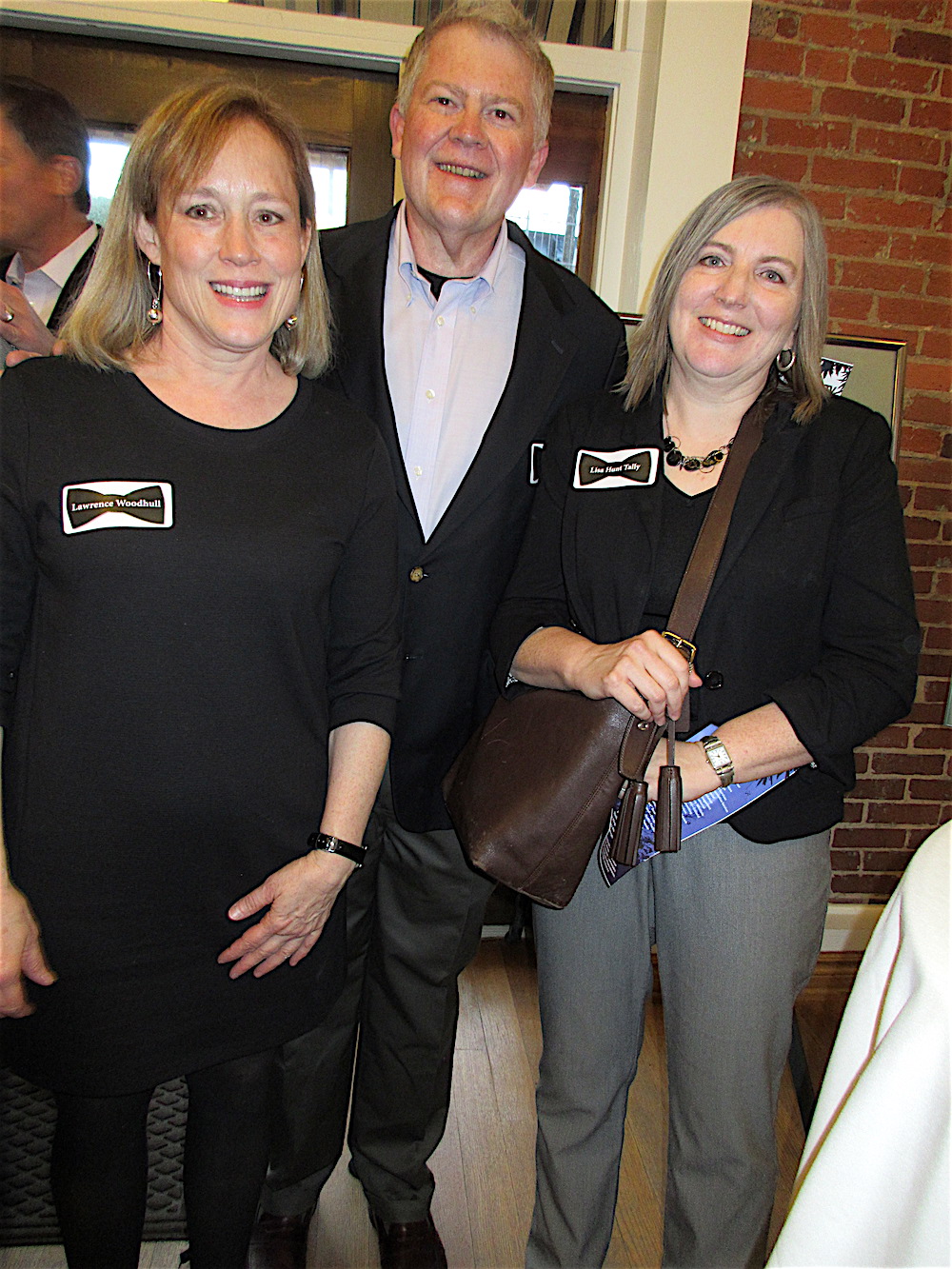 Lawrence Woodhull, left, with Steven and Lisa Hunt Tally.