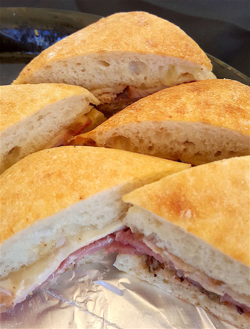 A closeup of Sweet P's muffaletta sandwiches.