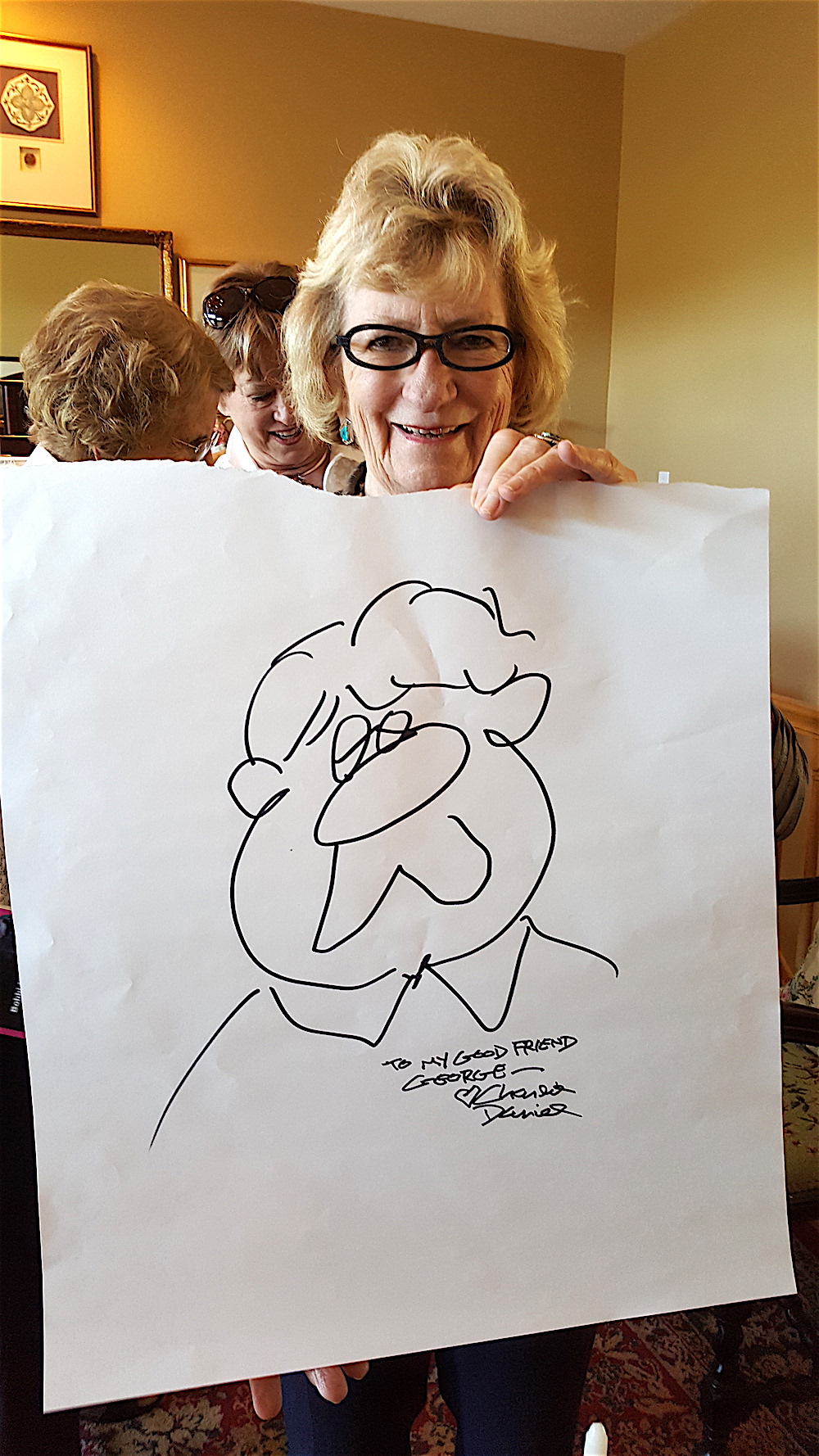 Georgiana scored a signed self-portrait by Charlie Daniel!