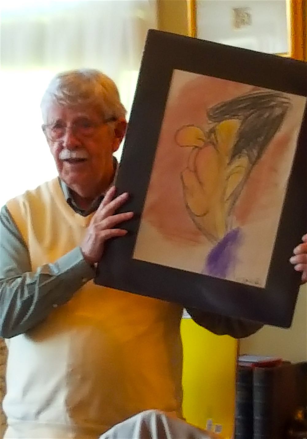 News Sentinel editorial cartoonist Charlie Daniel with his impression of Ronald Reagan, one of 11 presidents Daniel has drawn in his career.