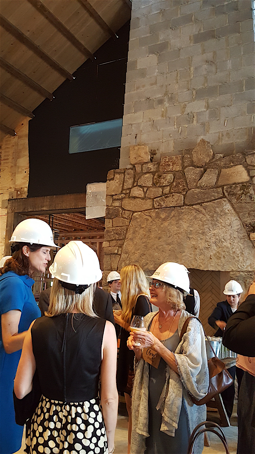 A hard hat cocktail party in the under construction events center at Blackberry Farm.
