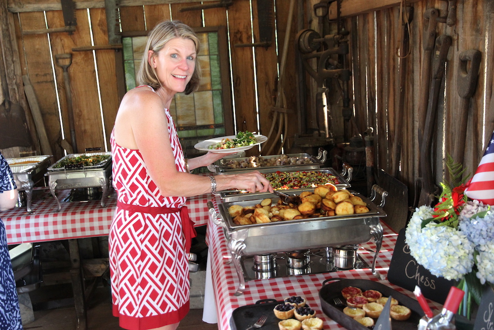 Annette Brun at the buffet. Notice the red, white and blue pies at bottom right. Those are the ones Tracy made.