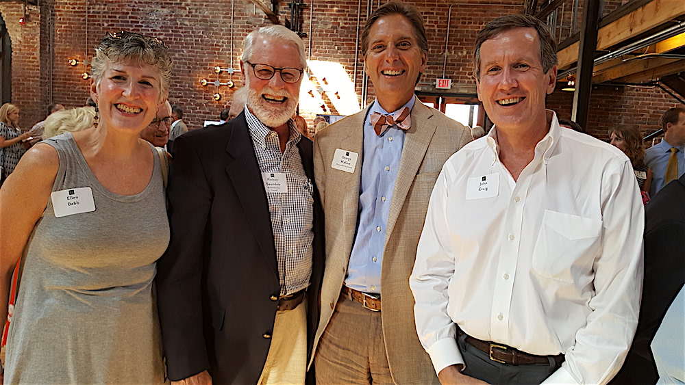 From left, Ellen Bebb, City Councilmen Finbarr Saunders and George Wallace and developer John Craig were among the festive crowd.