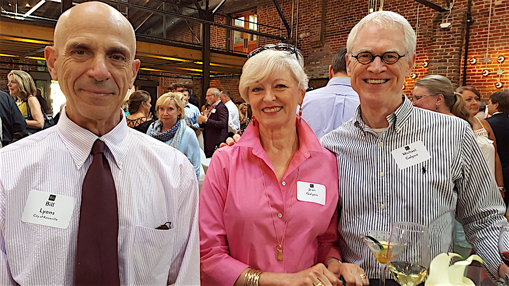 Bill Lyons, left, with Jean and Michael Galyon discussing downtown living. Lyons lives downtown already and the Galyons, who live in Sequoyah Hills, are toying with the idea.