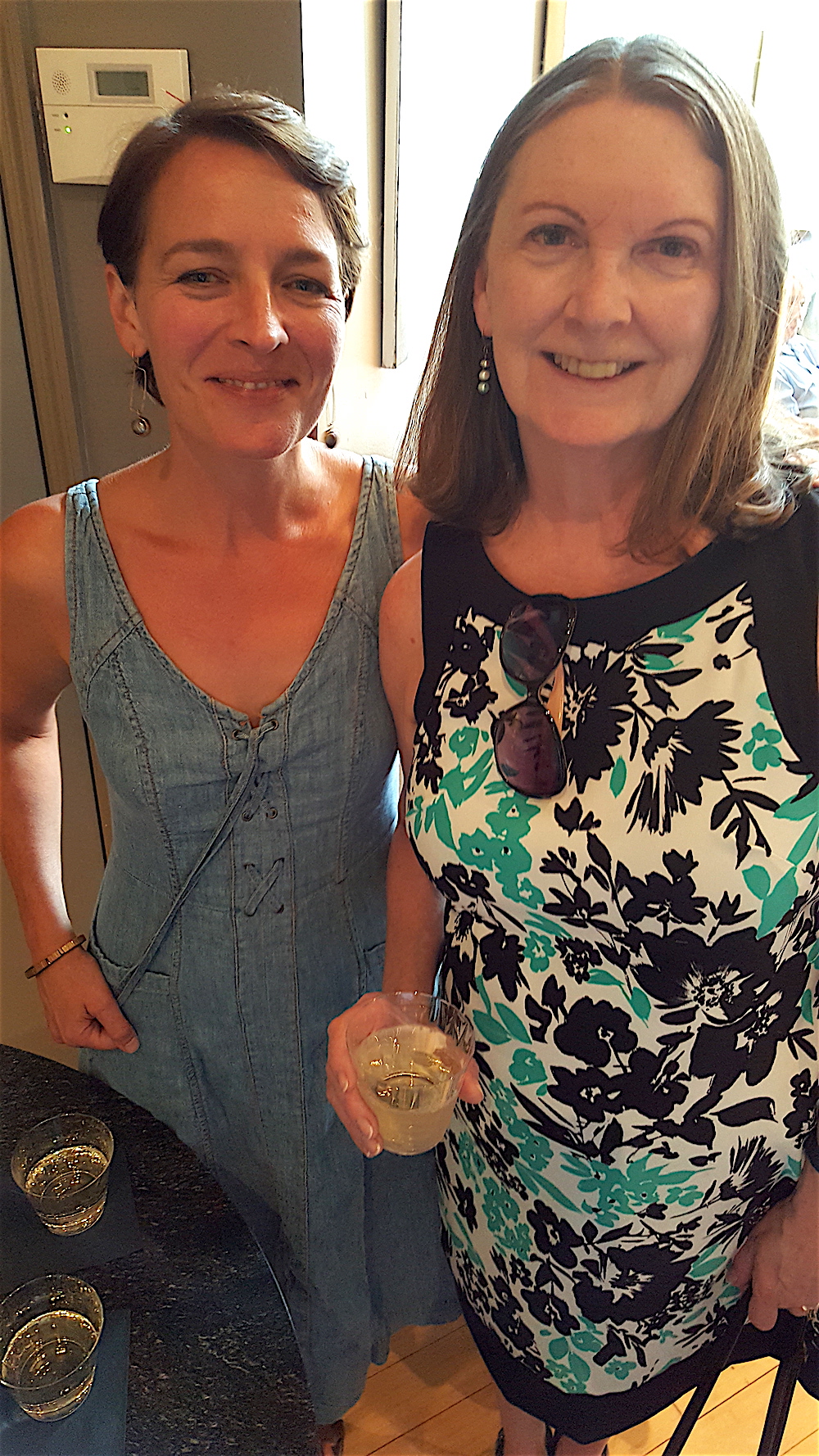 Megan Stair, left, played bartender for the evening. Here's Gay Lyons taking advantage of the service.