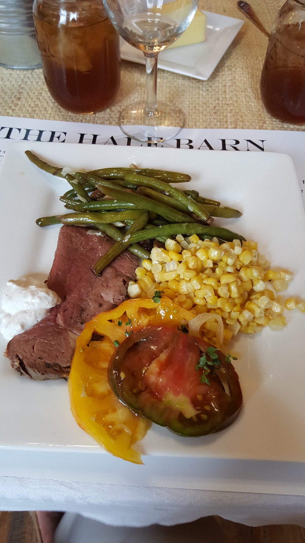 Soon, it was time to eat. Here's what we had: "Rose's Sunday Roast," fresh summer corn, sliced heirloom tomatoes with pickled onion, green beans with mushrooms and honey drizzle and biscuits.