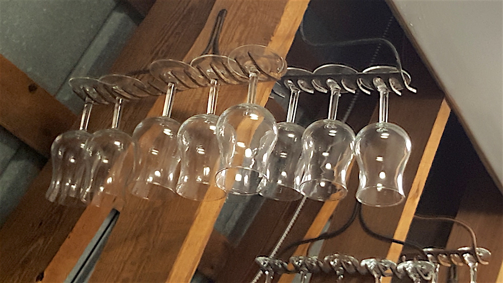 Old rakes were transformed into wine glass holders in the pantry. Very clever.