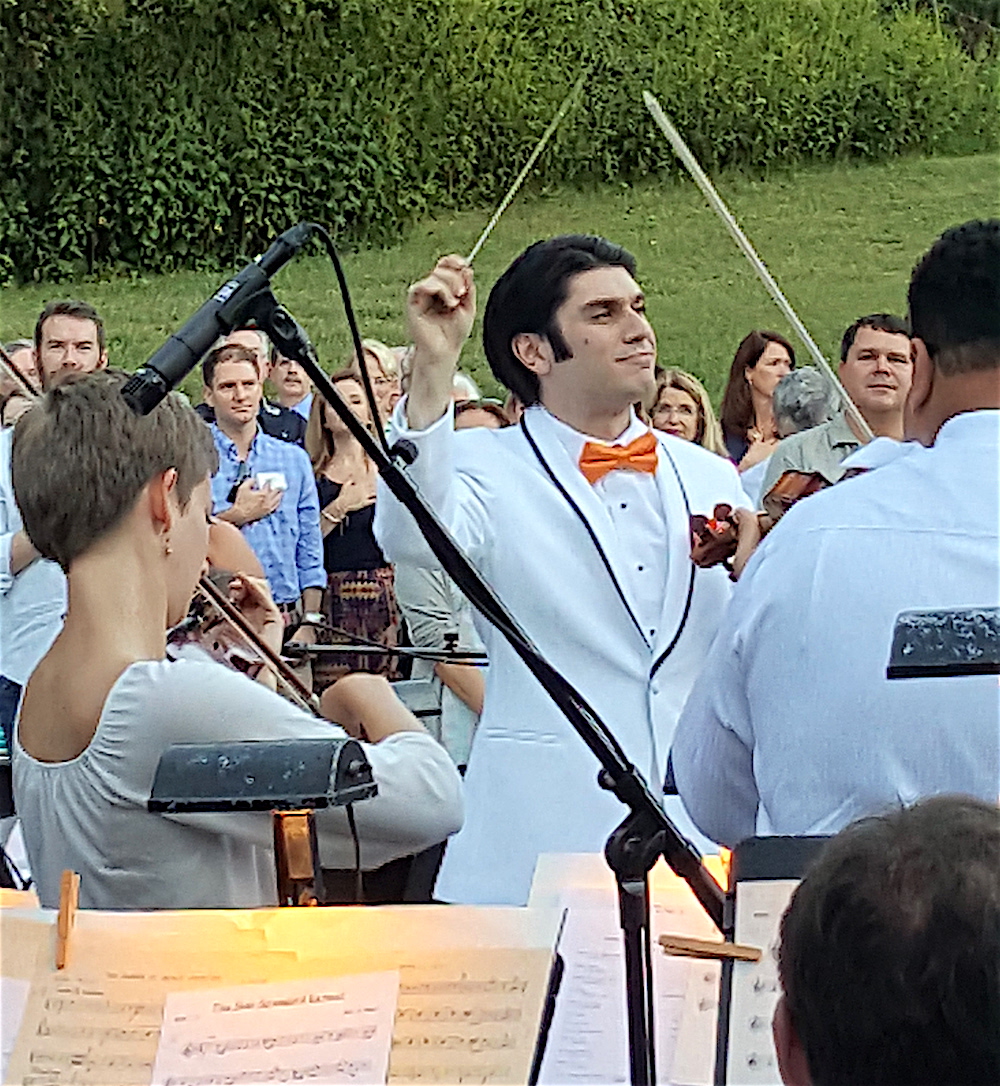 The KSO's new music director, Aram Demirjian, conducts the "Star Spangled Banner" to open Symphony in the Park on Sunday.