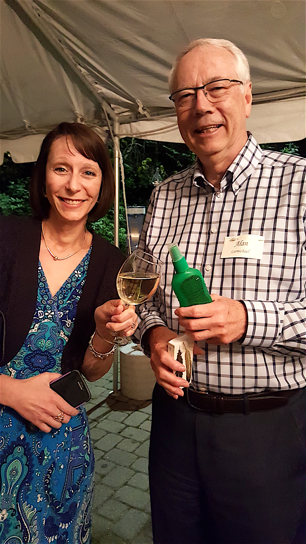 Cheers! My husband, Alan Carmichael, with his bug spray and Rachel Ford with a much better liquid.