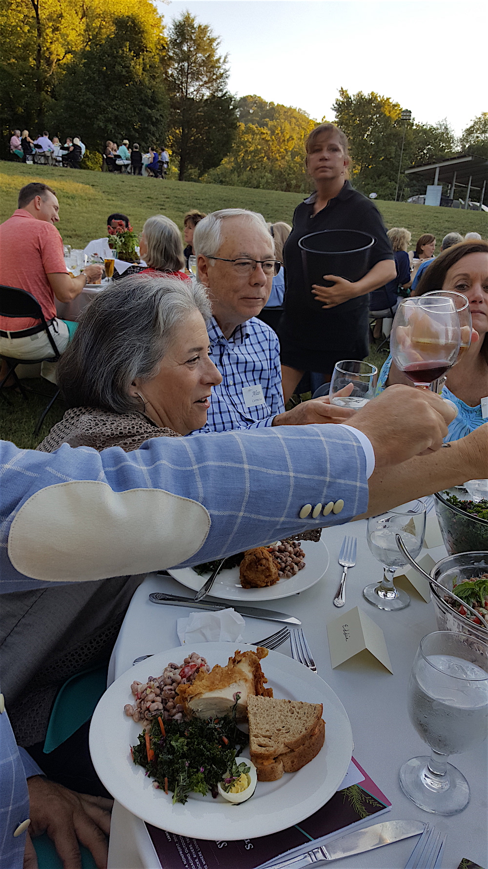 When it was time to sit, we at the Moxley Carmichael table started with a toast. Here's Mayor Rogero and Alan.