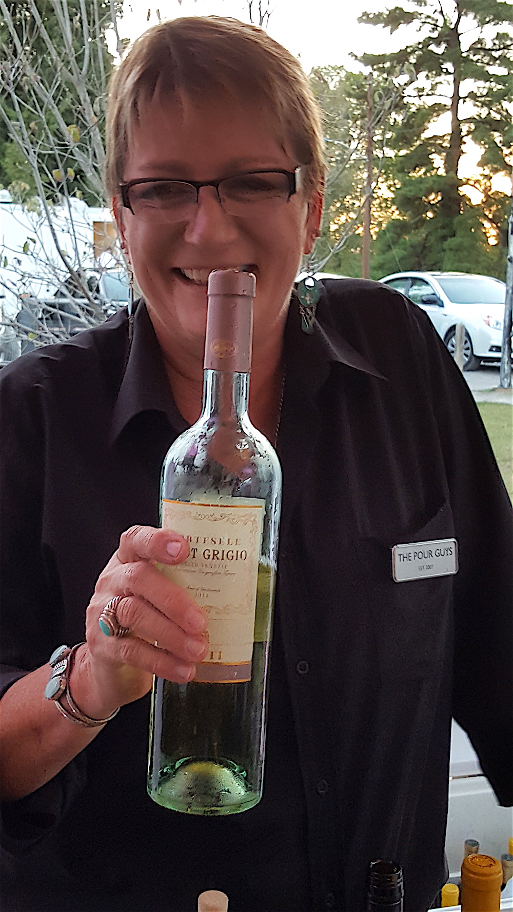 Antoinette Fritz offers a little magic potion for getting the bid prices up.