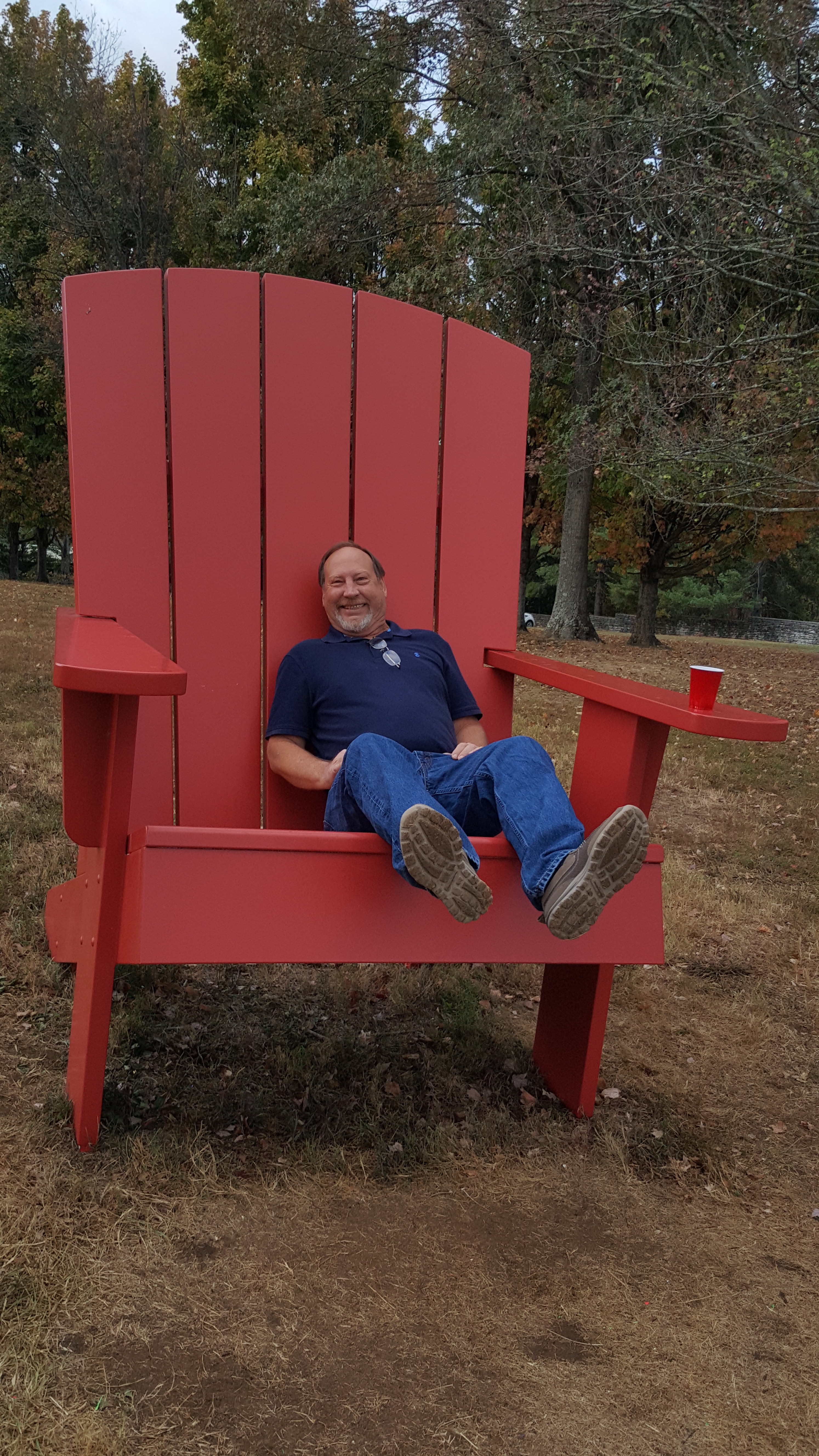 Before our guests arrived, Jimmy and I slipped over to the new "Secret Garden" on the property where he rested for a spell in this giant Adirondack chair. (I love that thing!)
