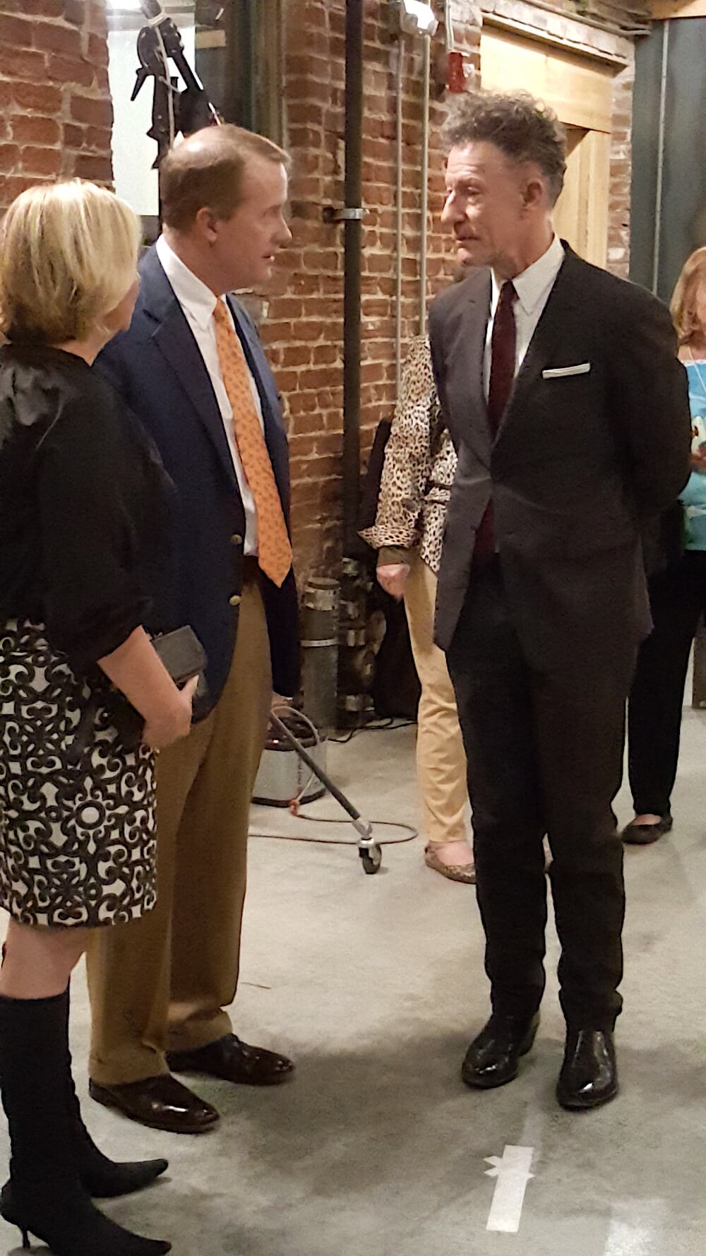 Lovett chatting with Angelia and Hugh Nystrom.