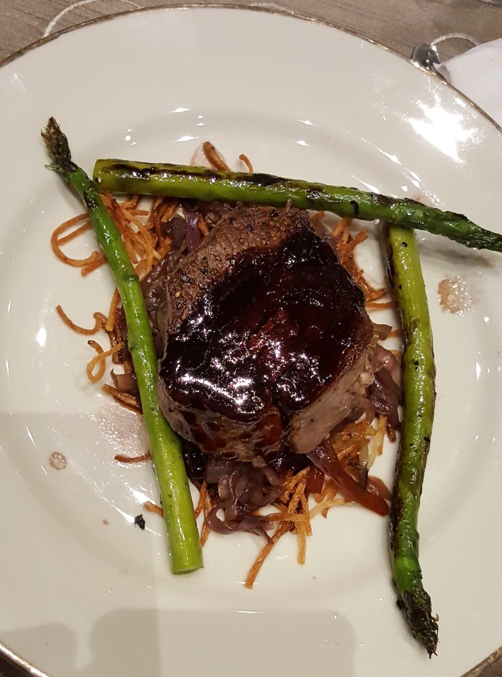 Check out the entree: roasted garlic-stuffed beef tenderloin with Western "plaid hash," grilled asparagus and Syrah demi-glace. This dish is a classic plate that has been on the menu of every restaurant Tim Love has had.