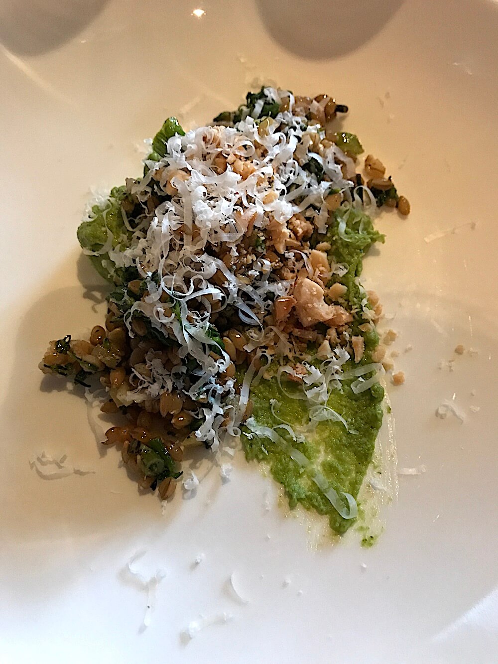 Check out this creative first course: grilled broccoli and farro with preserved lemon, Parmesan and Marcona almonds. We loved it.