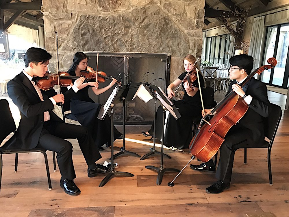Members of one of the KSO's youth orchestras set the tone as guests arrived. From left: Daniel Choo, Elizabeth Joo, Sarah Johnson and Jerry Zhou.